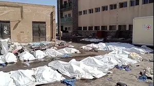 Bags containing bodies lie on the ground at Sweida National Hospital in Sweida, Syria, July 22, 2025